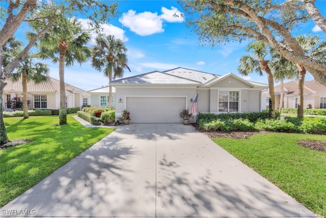 single story home featuring a garage and a front lawn