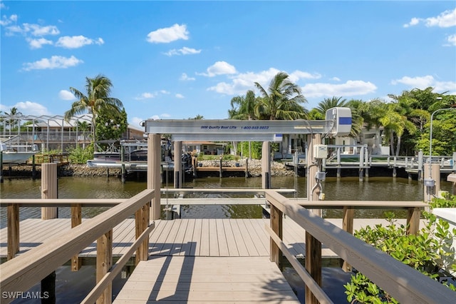 view of dock featuring a water view and boat lift