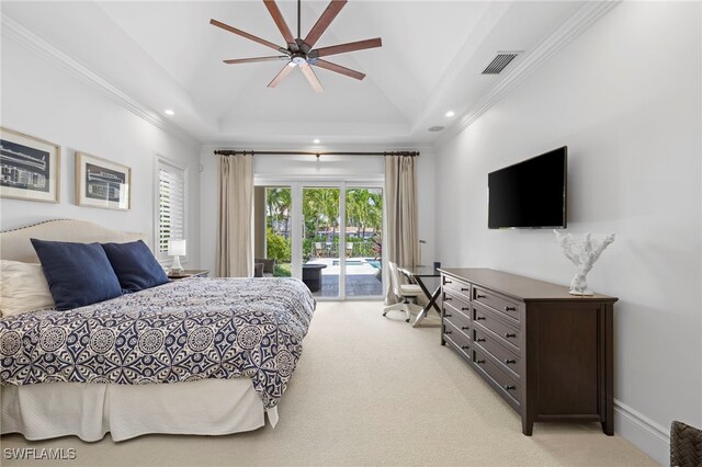 bedroom with ceiling fan, a tray ceiling, access to exterior, and light colored carpet