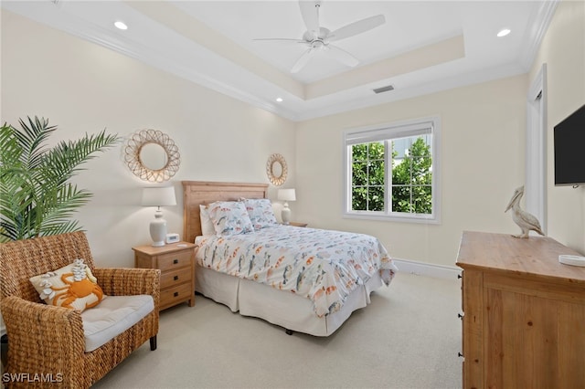 bedroom with light carpet, visible vents, a raised ceiling, crown molding, and recessed lighting