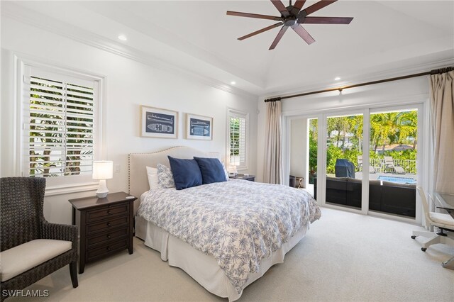 bedroom featuring light colored carpet, ornamental molding, a tray ceiling, ceiling fan, and access to exterior