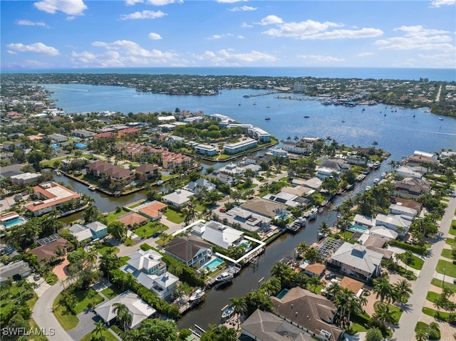 bird's eye view featuring a water view and a residential view