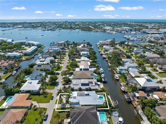 birds eye view of property with a water view and a residential view