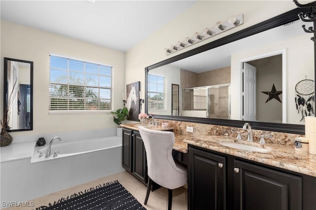 bathroom featuring tile patterned floors, vanity, and separate shower and tub