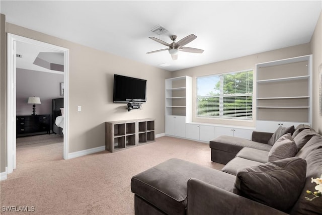 living room with carpet flooring and ceiling fan