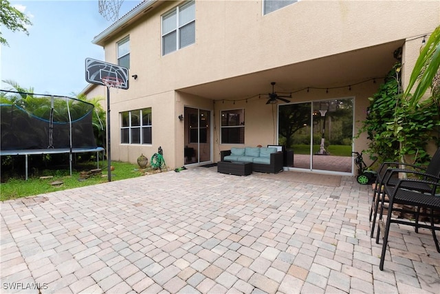 exterior space featuring ceiling fan, outdoor lounge area, a trampoline, and a patio