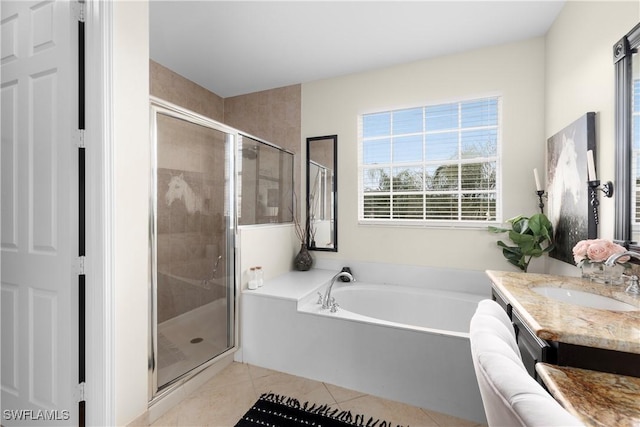 bathroom with tile patterned floors, vanity, and separate shower and tub