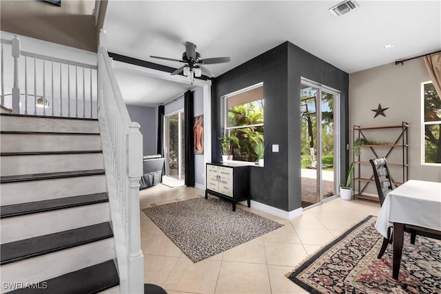 entryway featuring ceiling fan and light tile patterned flooring