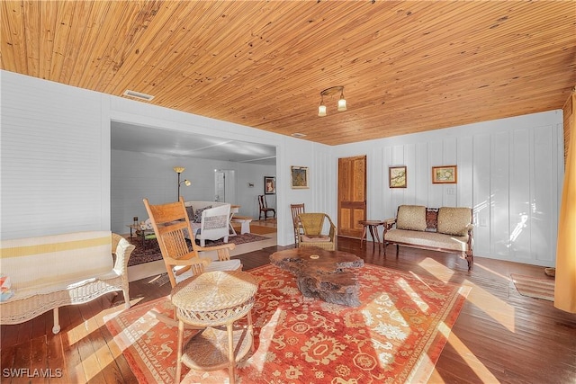 living area with hardwood / wood-style flooring and wood ceiling