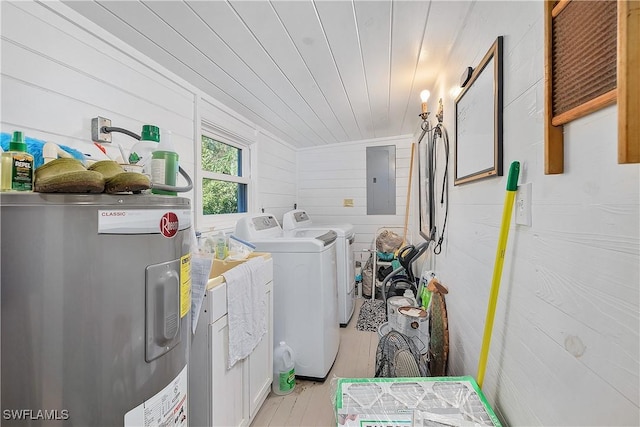 laundry area with wood walls, water heater, electric panel, wooden ceiling, and washer and clothes dryer