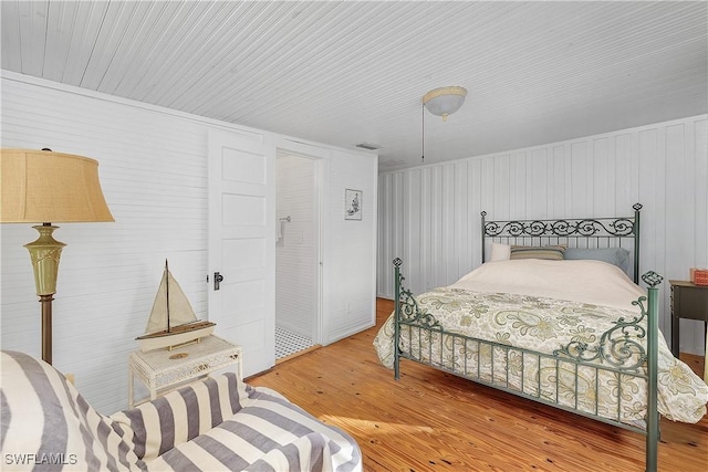 bedroom with hardwood / wood-style flooring