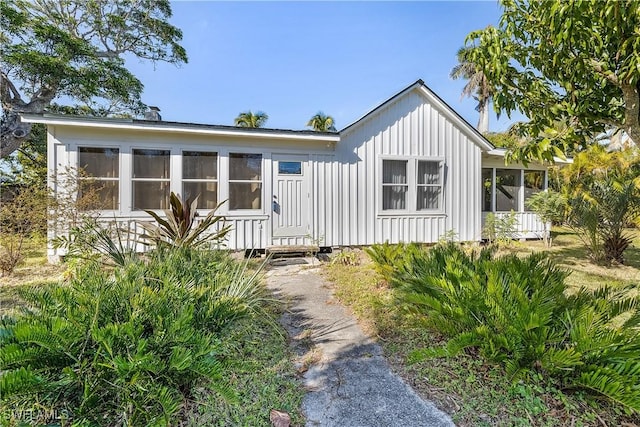 view of front of home with a sunroom