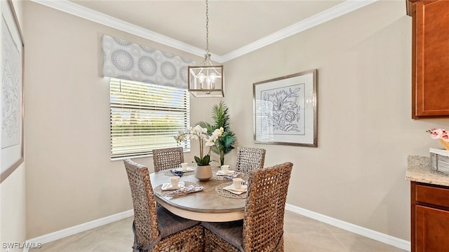 tiled dining room featuring a notable chandelier and ornamental molding