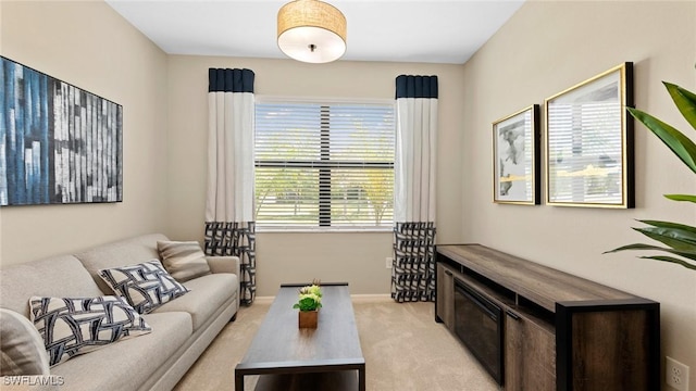 living room featuring light colored carpet and a wealth of natural light