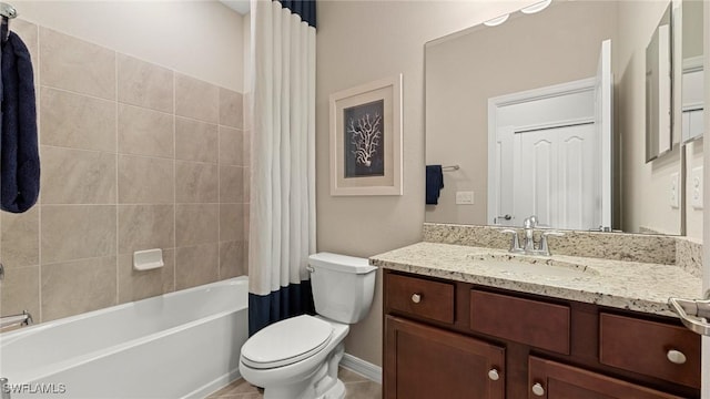 full bathroom with shower / bath combo with shower curtain, toilet, and vanity