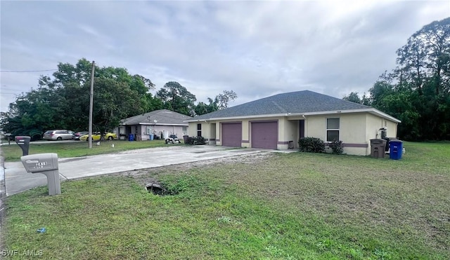 ranch-style home featuring a garage and a front lawn