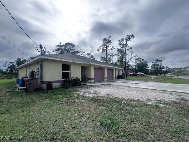 view of front of house with a garage and a front yard