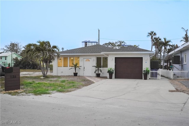 136 Hercules Dr, Fort Myers Beach, FL 33931 - view of front of house featuring a garage