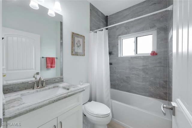 full bathroom featuring vanity, toilet, and shower / bath combo with shower curtain