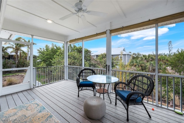 sunroom with ceiling fan and a healthy amount of sunlight