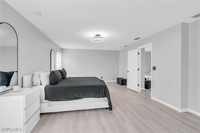 bedroom with light hardwood / wood-style flooring