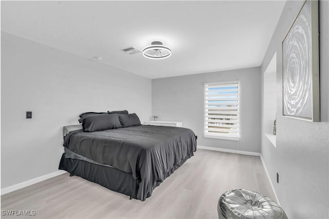 bedroom with light hardwood / wood-style flooring