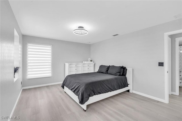 bedroom with light hardwood / wood-style flooring