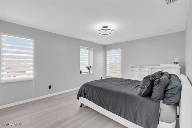 bedroom with light hardwood / wood-style floors