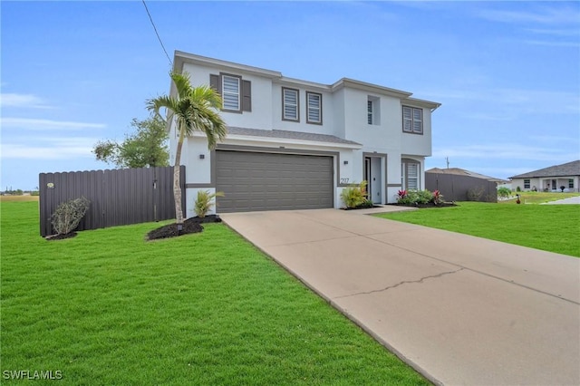 view of property featuring a garage and a front lawn