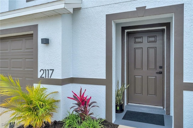 property entrance with a garage