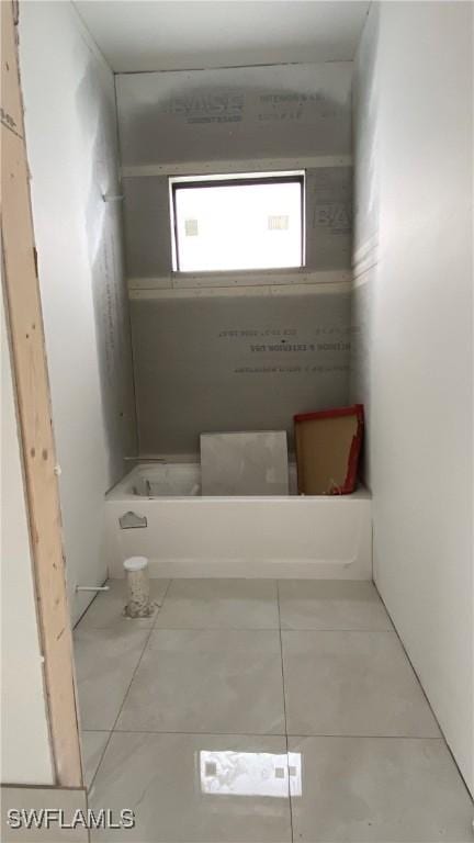 bathroom with tile patterned floors