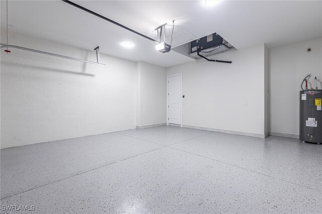 3005 28th St SW, Lehigh Acres, FL 33976 - garage featuring water heater and a garage door opener