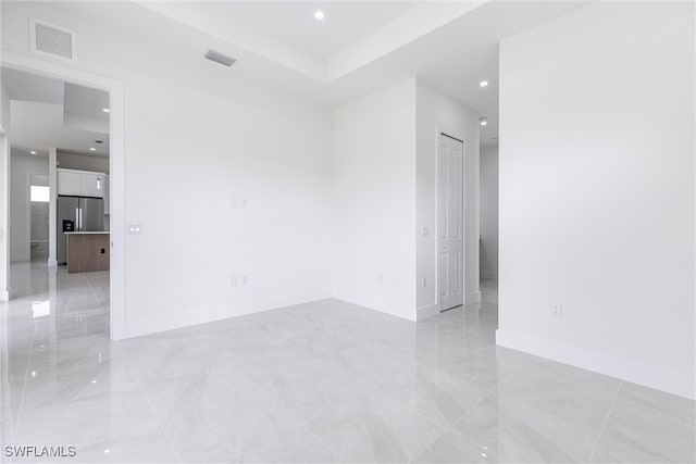 3005 28th St SW, Lehigh Acres, FL 33976 - spare room with recessed lighting, light marble finish flooring, and baseboards