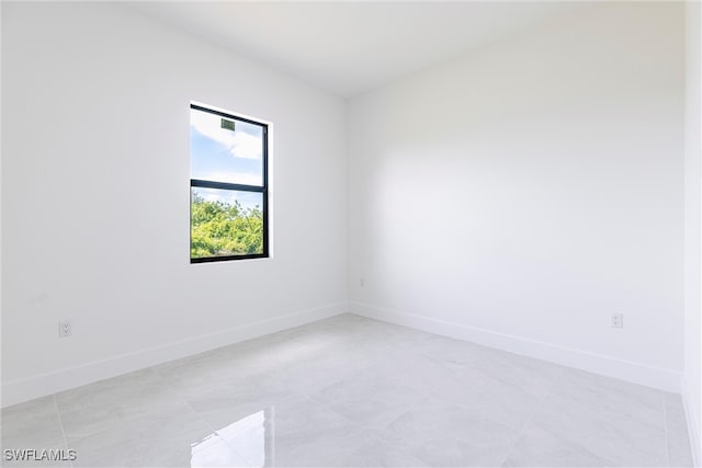 3005 28th St SW, Lehigh Acres, FL 33976 - spare room with baseboards