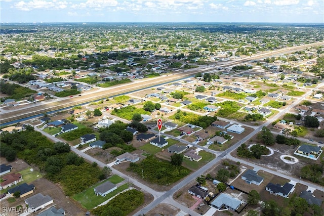 3005 28th St SW, Lehigh Acres, FL 33976 - aerial overview of property's location with nearby suburban area