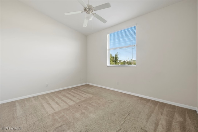 empty room with light carpet and ceiling fan