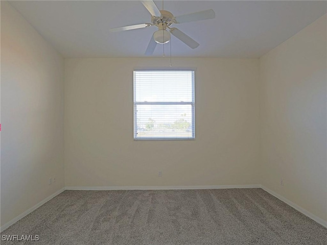 unfurnished room featuring ceiling fan, carpet floors, and baseboards