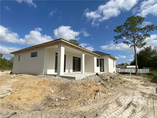 rear view of property with a patio