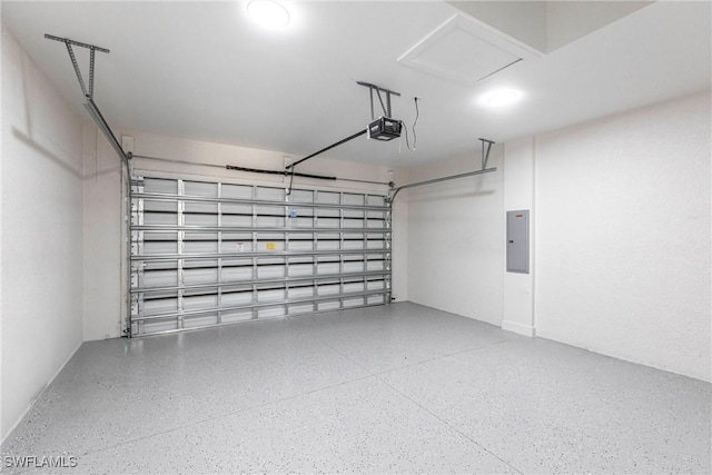 garage with a garage door opener and electric panel