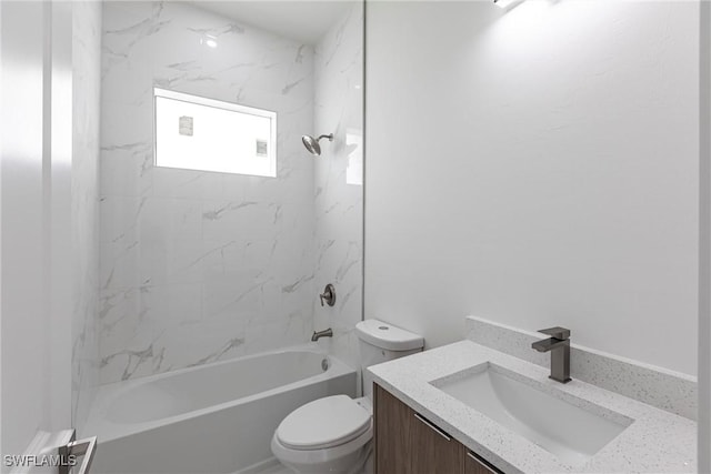 bathroom with toilet, vanity, and shower / bath combination