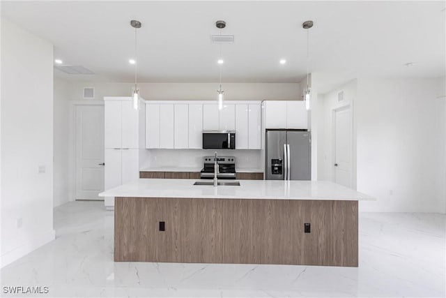 kitchen featuring stainless steel appliances, light marble finish flooring, a large island, white cabinets, and recessed lighting