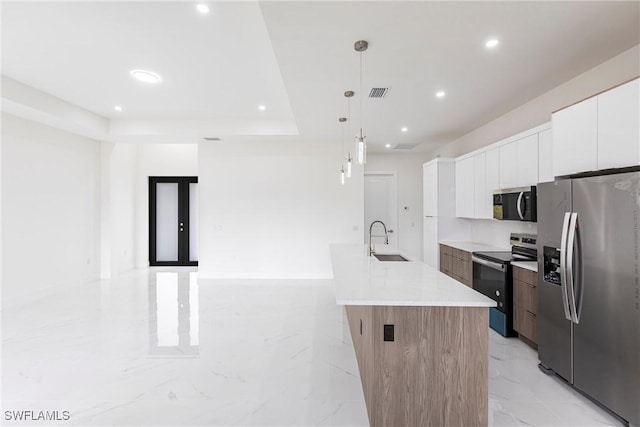 kitchen with appliances with stainless steel finishes, modern cabinets, light marble finish flooring, white cabinets, and recessed lighting