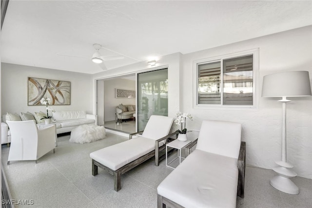 living room featuring ceiling fan