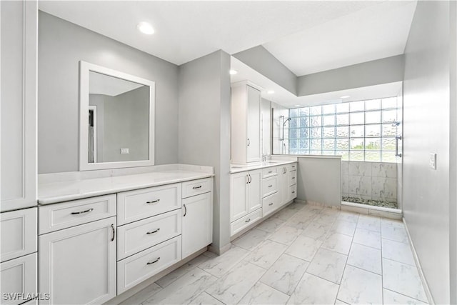 bathroom featuring vanity and walk in shower