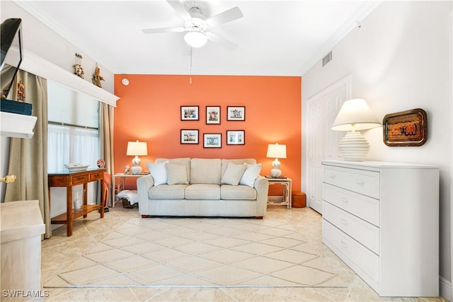 living room featuring crown molding and ceiling fan