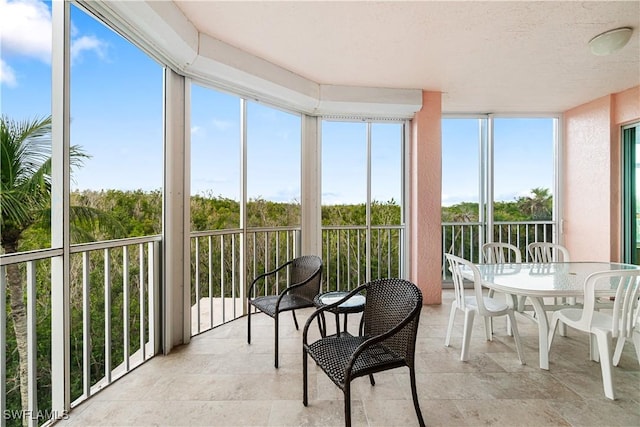 sunroom / solarium featuring a healthy amount of sunlight