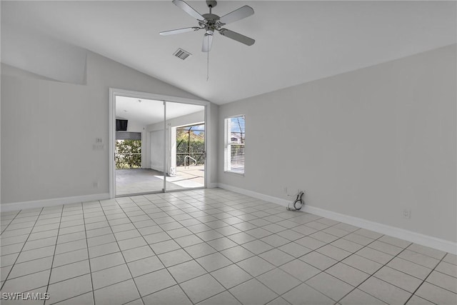 empty room featuring baseboards, visible vents, vaulted ceiling, and a ceiling fan