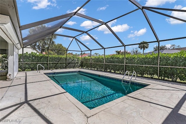 pool with a patio area and a lanai