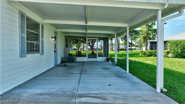 view of patio / terrace with central air condition unit and a carport