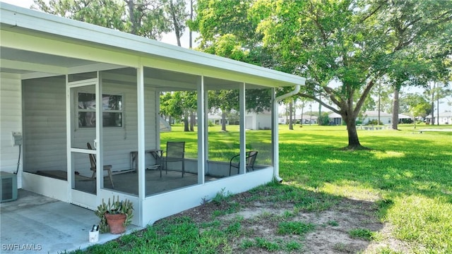 view of yard with a sunroom